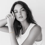 Model wearing 18k gold Morse code bracelet on colorful nylon cord — personalized gift for her birthday or friendship