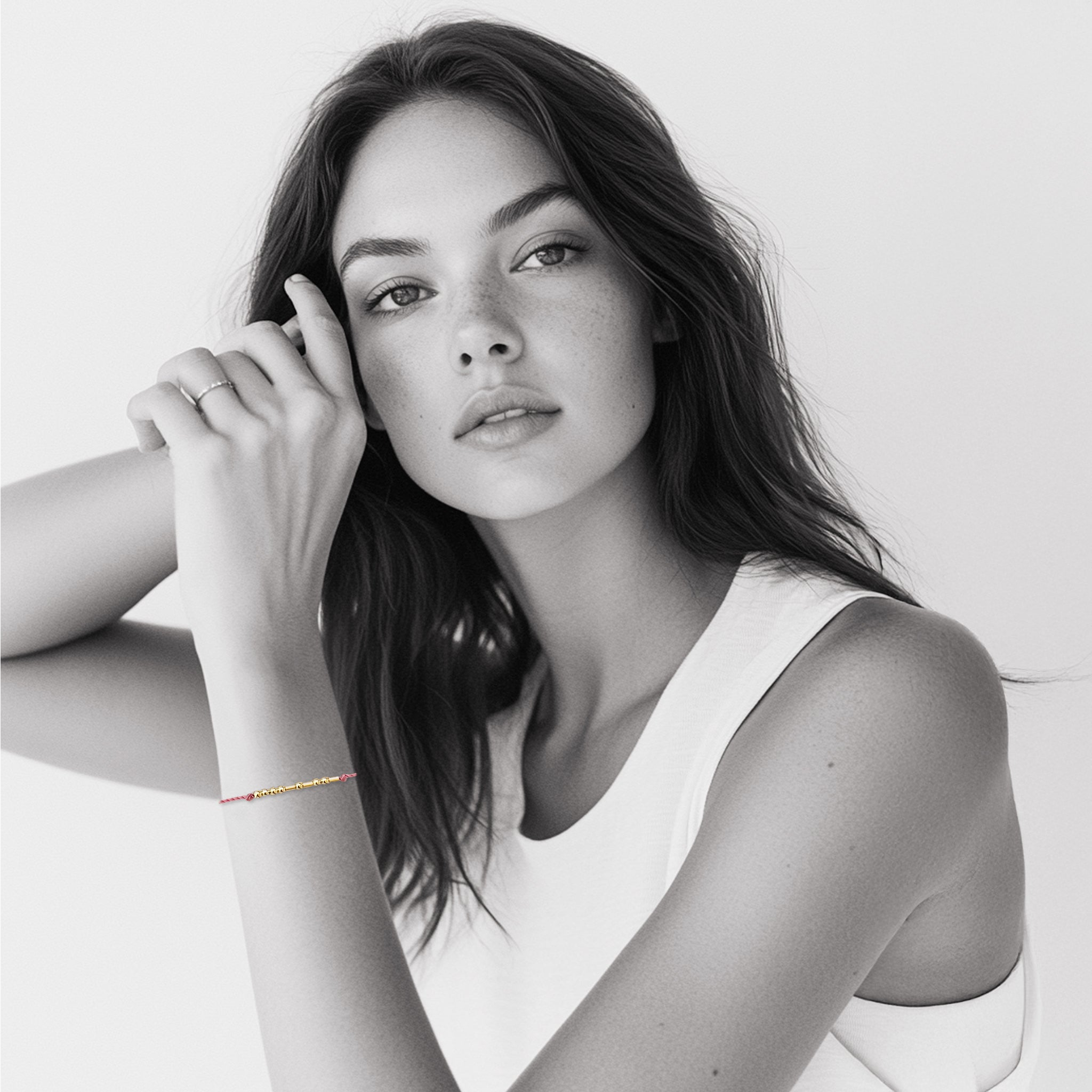 Model wearing 18k gold Morse code bracelet on colorful nylon cord — personalized gift for her birthday or friendship