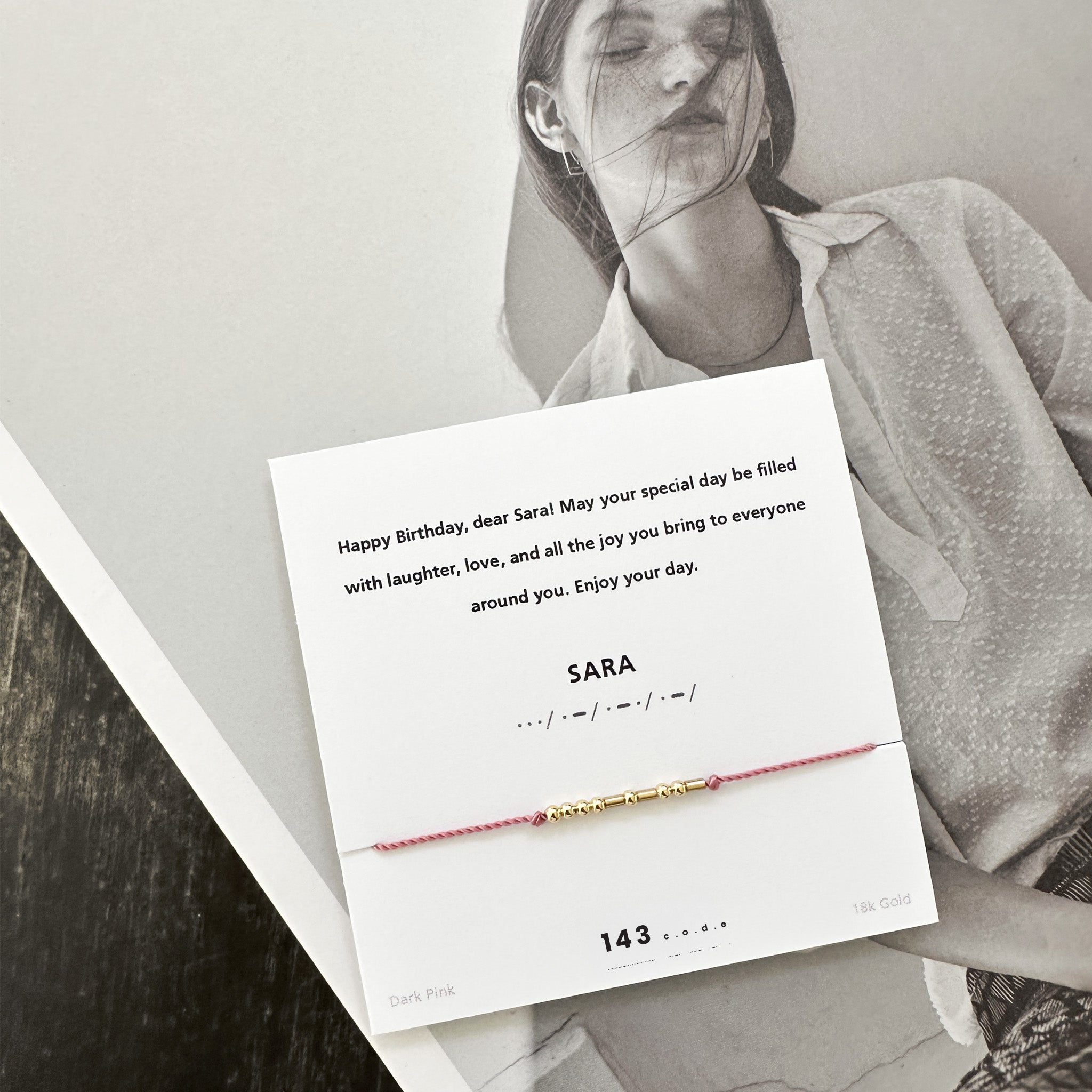 Personalized message card with 18k gold Morse code bracelet on pink nylon cord — meaningful gift for best friend