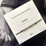 black nylon cord bracelet with oxidized Morse code beads — subtle gift for men, shown with gift card